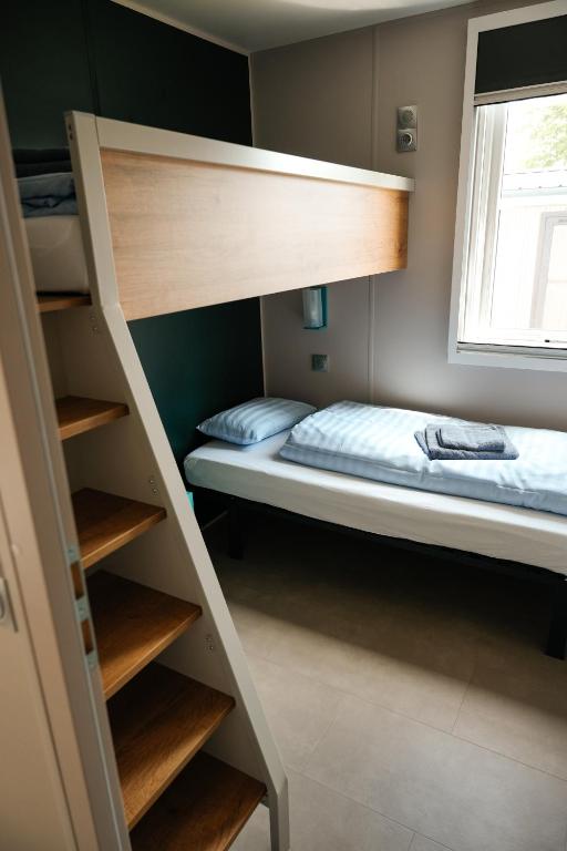 Postel nebo postele na pokoji v ubytování O'Hara Living - Camping Belle-Vue