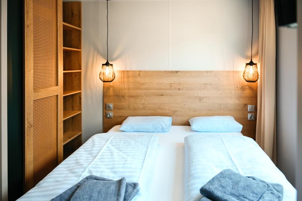 Postel nebo postele na pokoji v ubytování O'Hara Living - Camping Belle-Vue