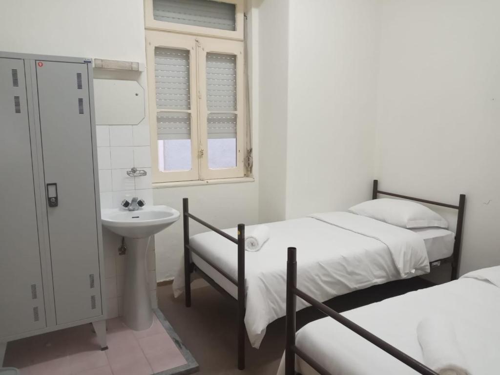 Un pat sau paturi într-o cameră la Residencial Ideal