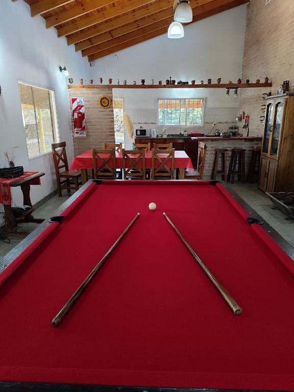 a pool table with two cue balls on top of it at La Villarense in Buenos Aires