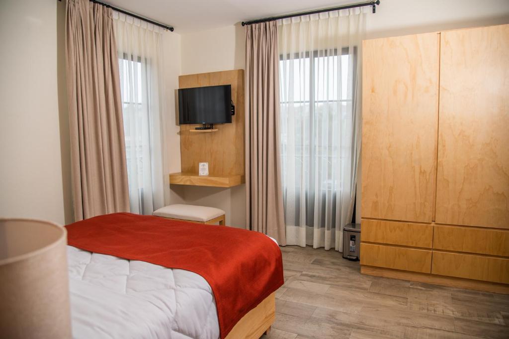 Postel nebo postele na pokoji v ubytování Quinta Mercedes