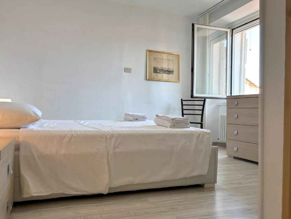 Ένα ή περισσότερα κρεβάτια σε δωμάτιο στο La Dimora dei Pescatori