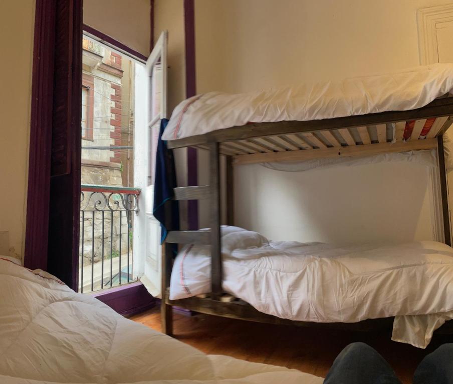 Uma cama ou camas num quarto em Art Hostel Casa Chaman