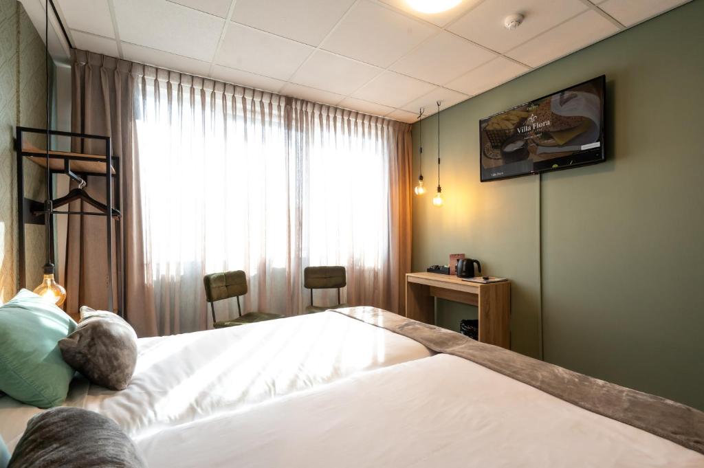 TV a/nebo společenská místnost v ubytování Hotel Villa Flora