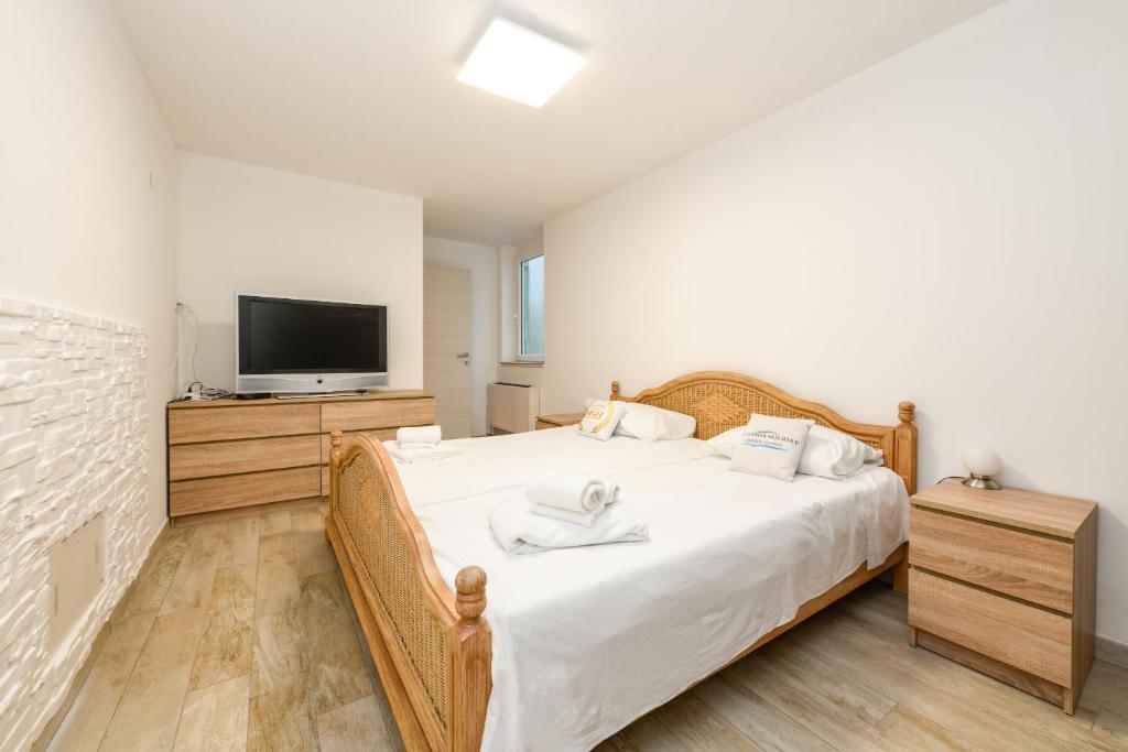 Postel nebo postele na pokoji v ubytování MGH Luxury - Villa Marlene