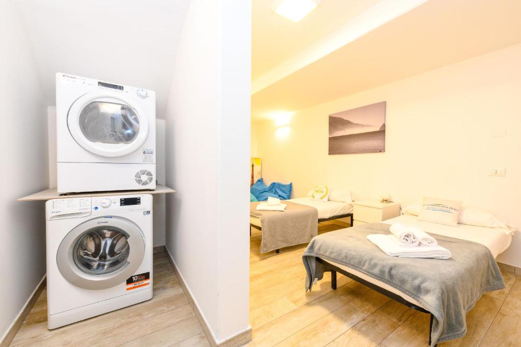 Postel nebo postele na pokoji v ubytování MGH Luxury - Villa Marlene