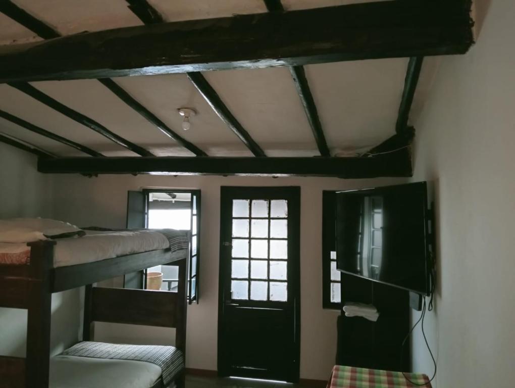 TV a/nebo společenská místnost v ubytování Villa Candelaria Hostel