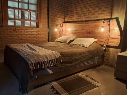 Ένα ή περισσότερα κρεβάτια σε δωμάτιο στο Suite Pedro - Casa Tapera Nova