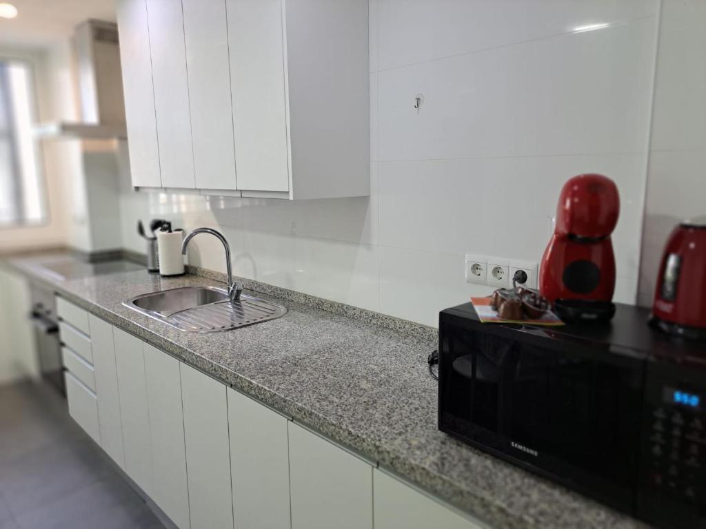 Kuchyňa alebo kuchynka v ubytovaní Jenofonte ZJ Apartment
