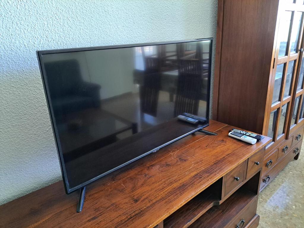Televízia a/alebo spoločenská miestnosť v ubytovaní Jenofonte ZJ Apartment