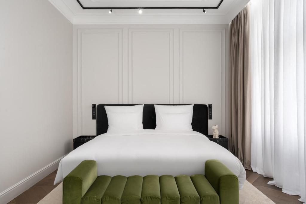 Postel nebo postele na pokoji v ubytování The Amauris Vienna - Relais & Châteaux