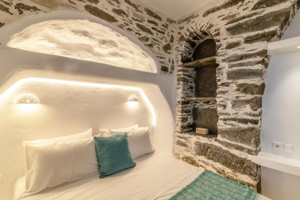 Postel nebo postele na pokoji v ubytování Lumina Kardiani