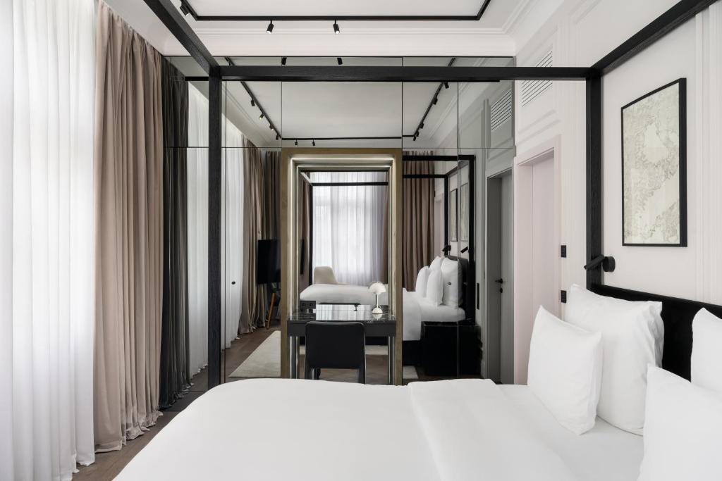 Postel nebo postele na pokoji v ubytování The Amauris Vienna - Relais & Châteaux