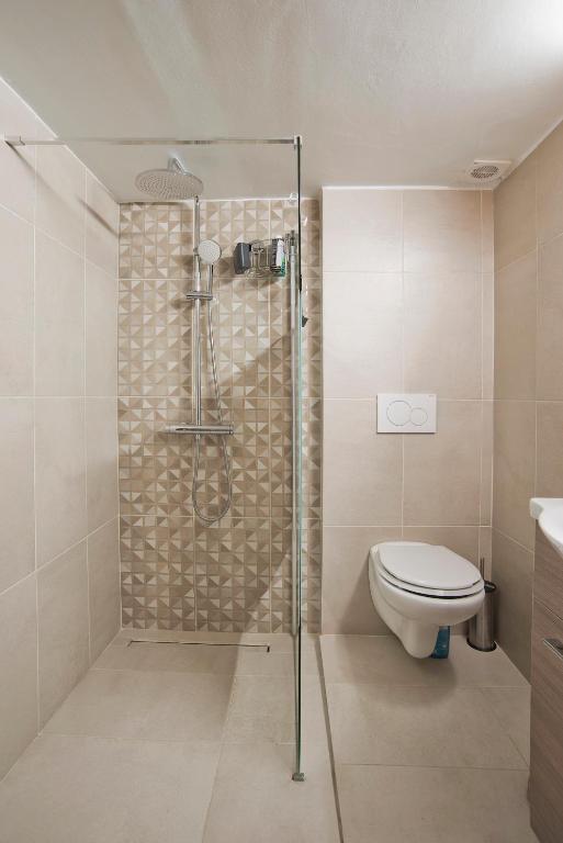 Koupelna v ubytování SeaLiv Apartment by LobbySquare