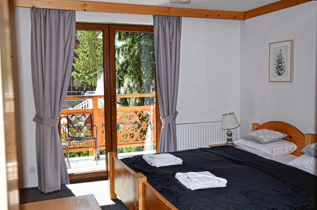 Posteľ alebo postele v izbe v ubytovaní Villa Kaplowa Chata & SPA