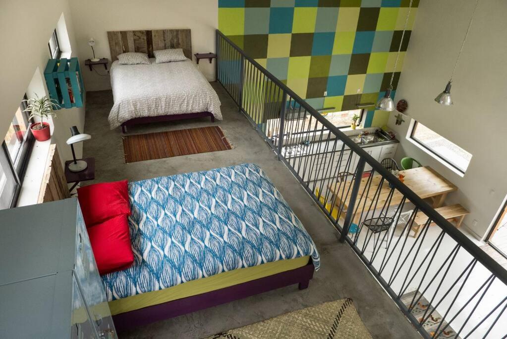 a small room with a bed and a staircase at Modern architecture with great view in San Agustín Etla