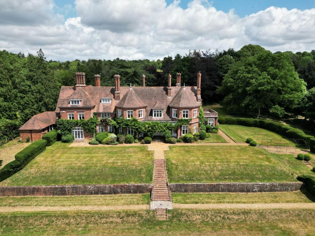 an estate with a large house on a grass field at Alward House by Group Retreats in Salisbury