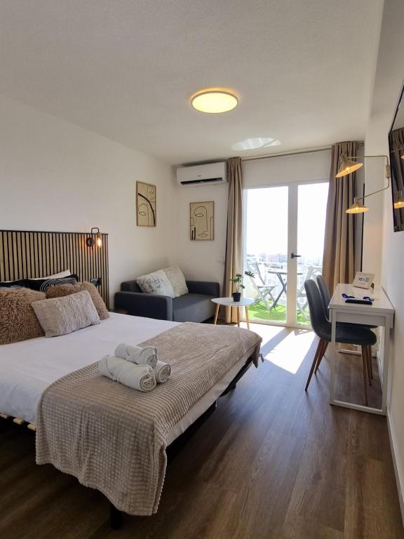 Postel nebo postele na pokoji v ubytování Acuario Moderno estudio Vistas al mar