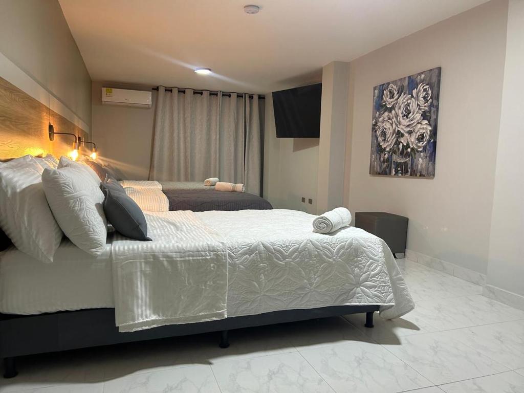 Postel nebo postele na pokoji v ubytování Provenza Medellin Hotel Boutique
