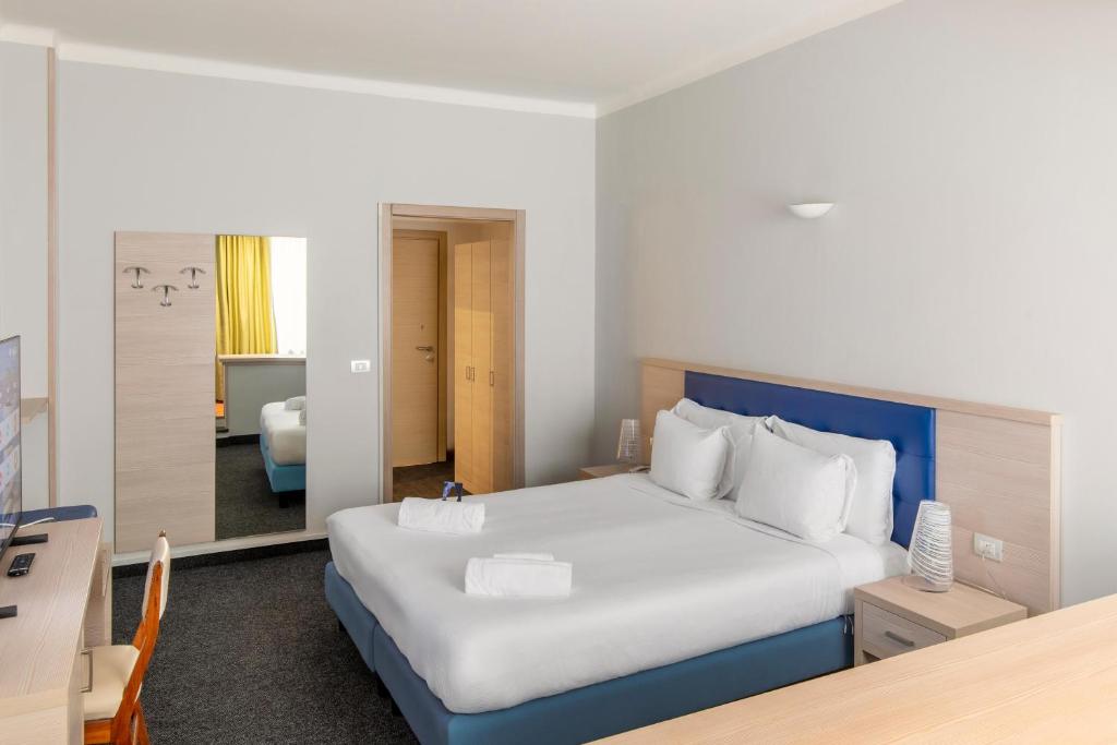 Кровать или кровати в номере B&B Hotels Park Hotel Suisse Santa Margherita Ligure