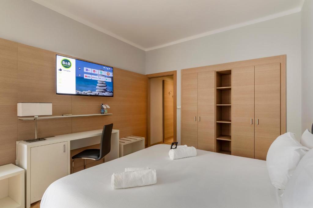 Кровать или кровати в номере B&B Hotels Park Hotel Suisse Santa Margherita Ligure