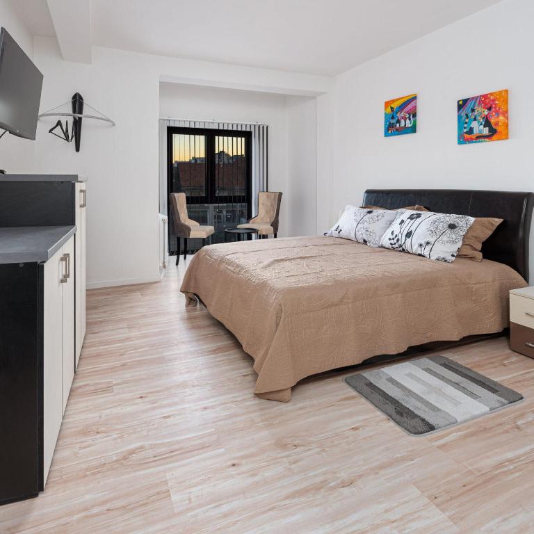 Postel nebo postele na pokoji v ubytování Fenix Apartments