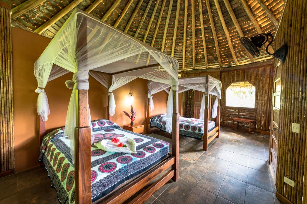 Postel nebo postele na pokoji v ubytování Luna Lodge