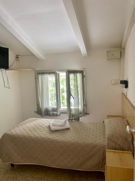 Postel nebo postele na pokoji v ubytování Hotel Adler