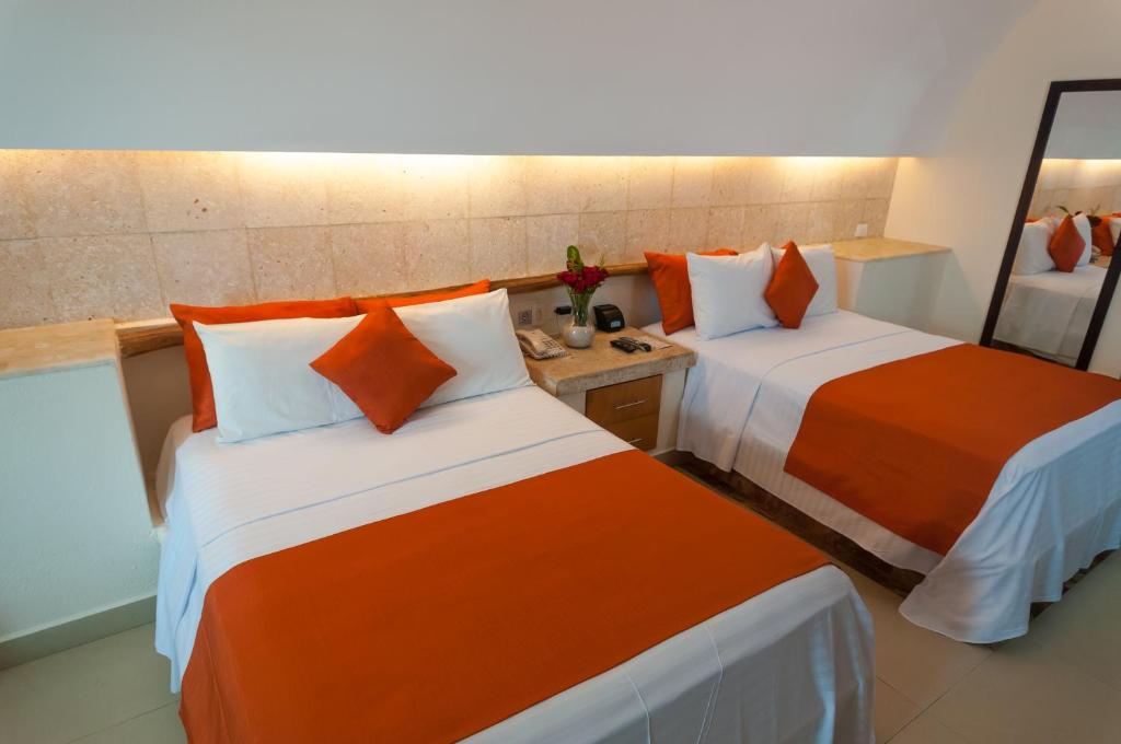 Postel nebo postele na pokoji v ubytování Artisan Playa Esmeralda Family Beach Hotel