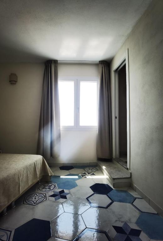 Postel nebo postele na pokoji v ubytování Appartamenti - Villa Mare