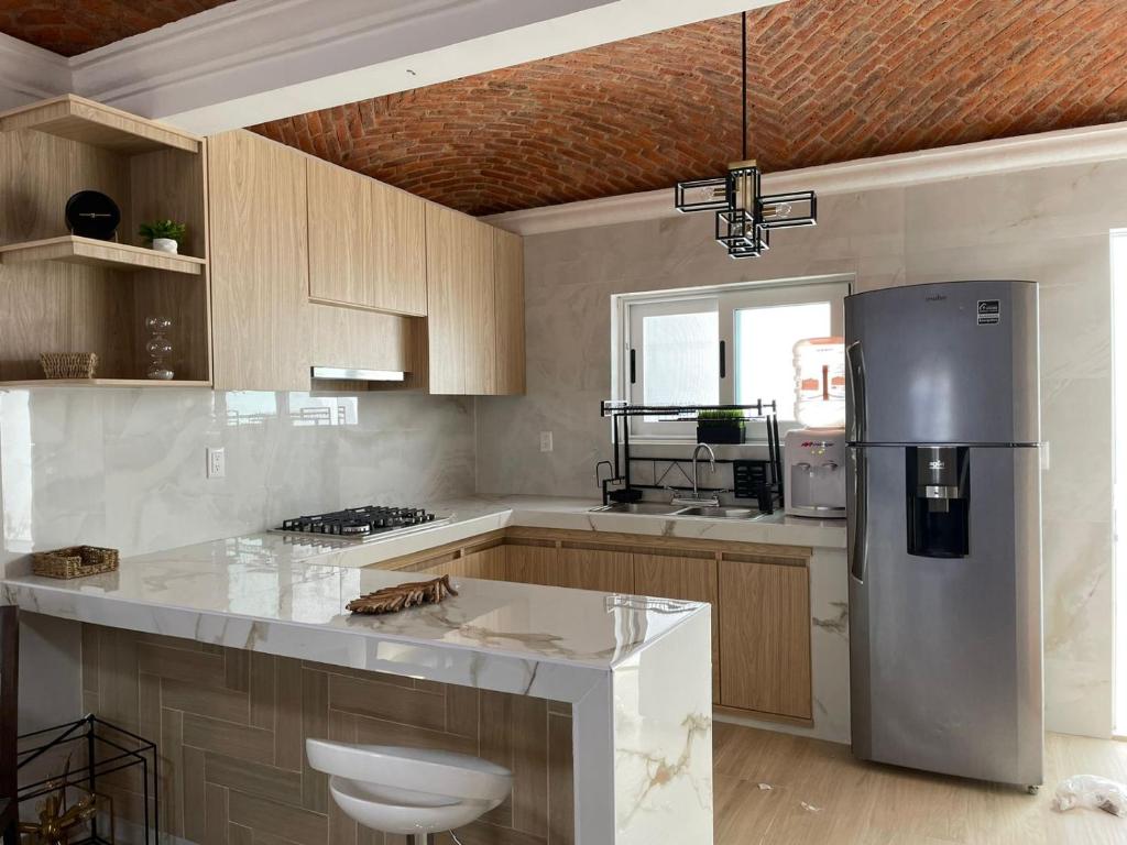 Kuchyň nebo kuchyňský kout v ubytování hRuiz Lodgments