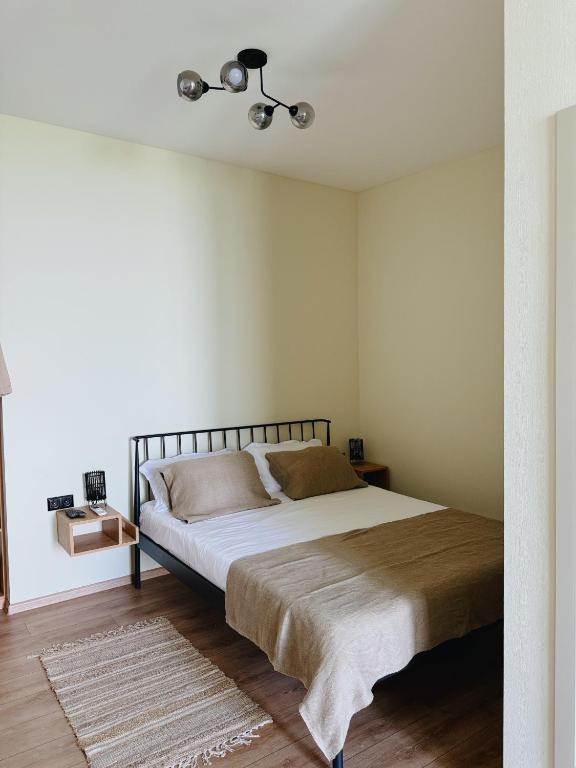 Postel nebo postele na pokoji v ubytování Cozy Rooms with View, Sighnaghi