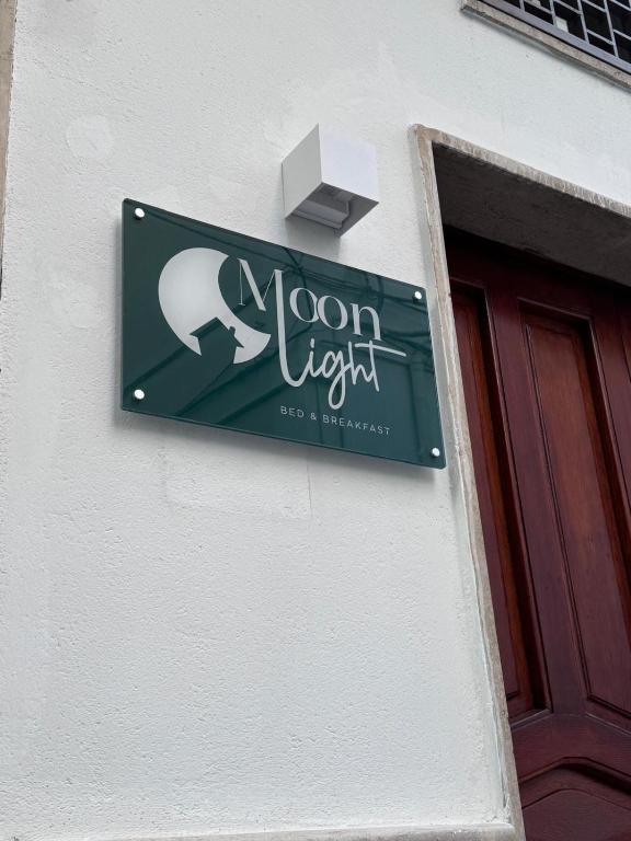 a sign on the side of a building at Moonlight B&B in Canosa di Puglia