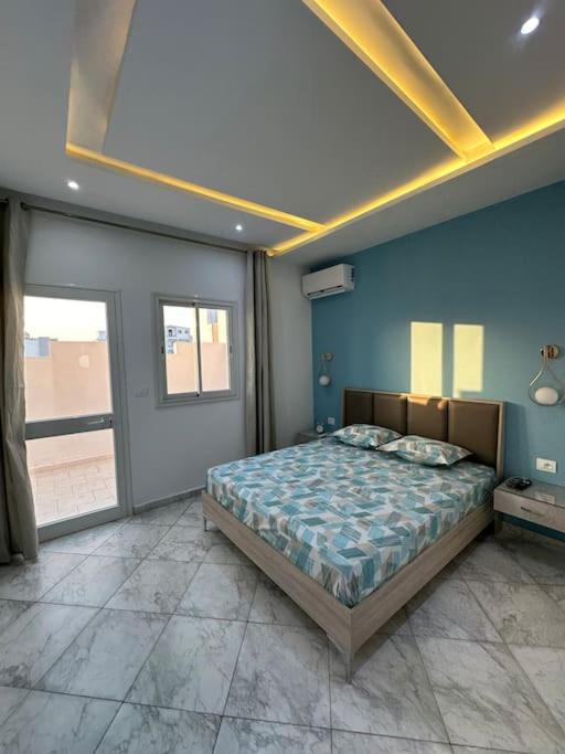 Postel nebo postele na pokoji v ubytování Blue'ming Sousse