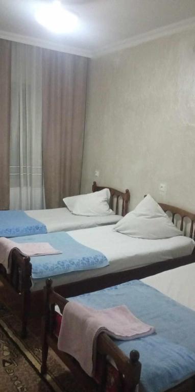 Voodi või voodid majutusasutuse Hotel Nikea Paradiso toas