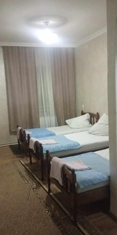 Voodi või voodid majutusasutuse Hotel Nikea Paradiso toas