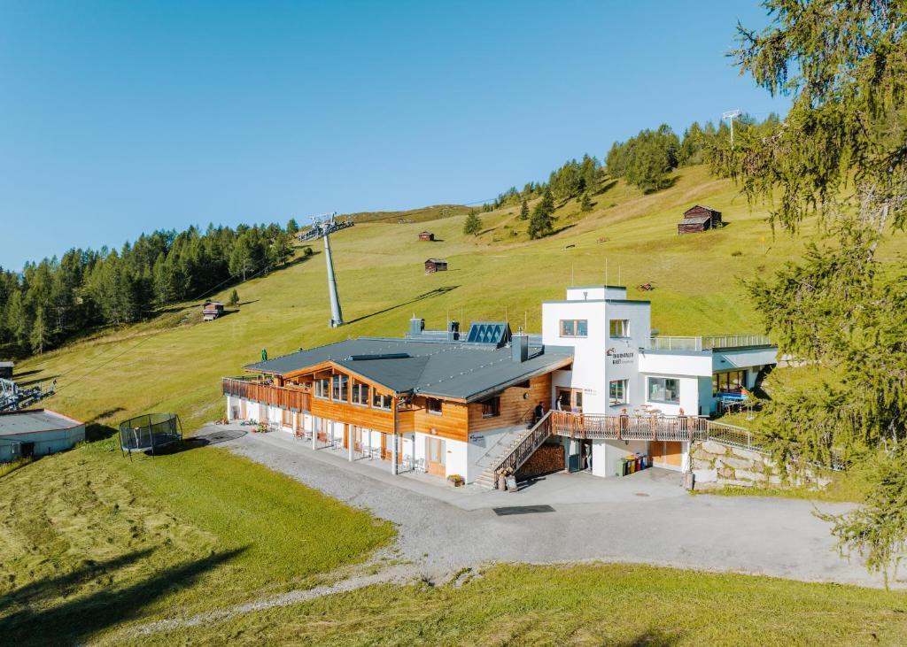 an aerial view of a house on a hill at Thurntaler Rast in Außervillgraten