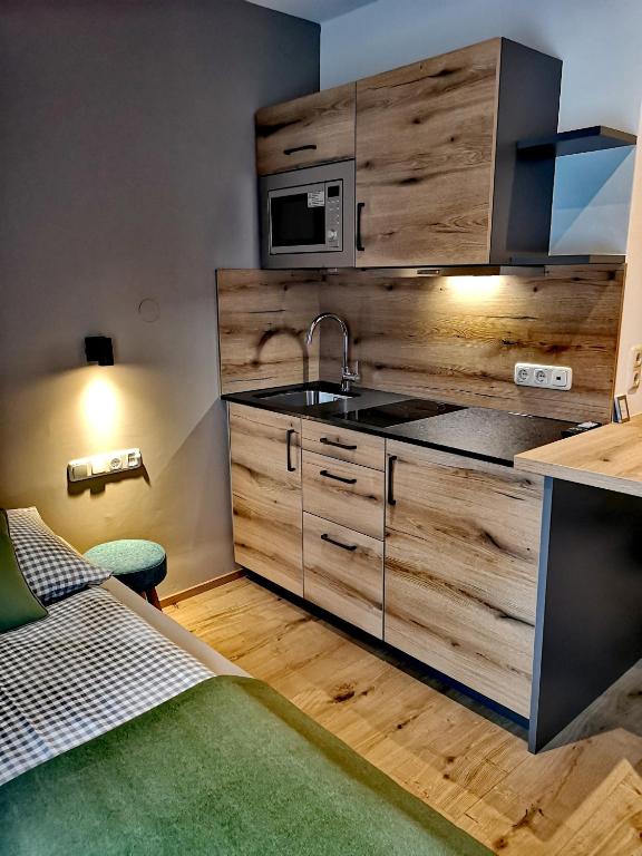 Kuchyň nebo kuchyňský kout v ubytování Hotel Apartment Das Au- Gut