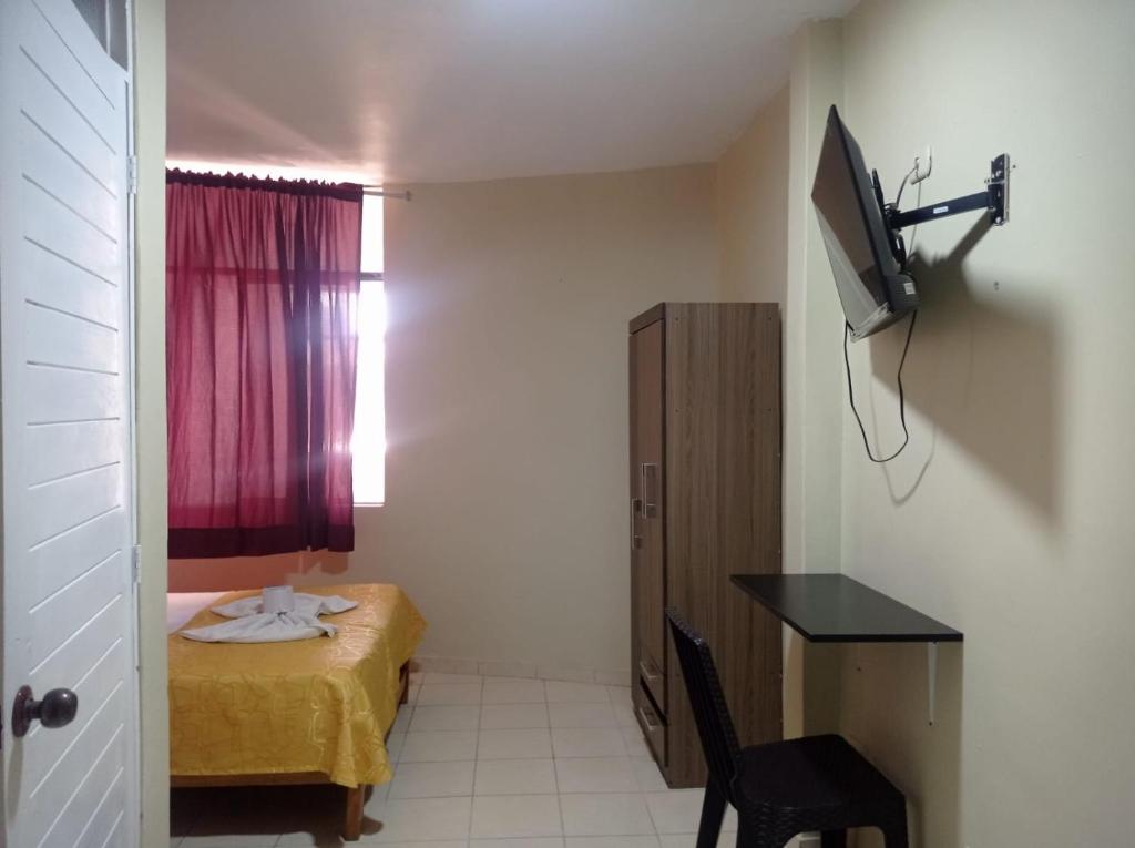 Postel nebo postele na pokoji v ubytování Hostal Real Piura - Oficial