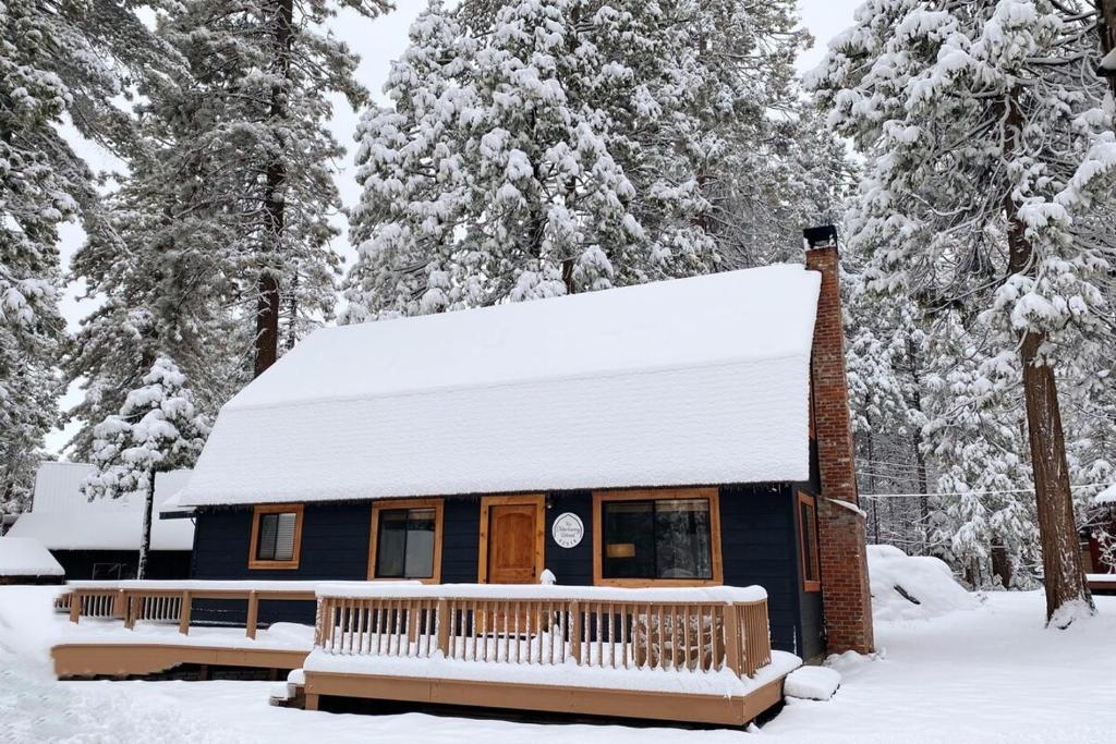 a blue house with snow on top of it at The Elderberry Retreat - It's A Dream Location! in Shaver Lake