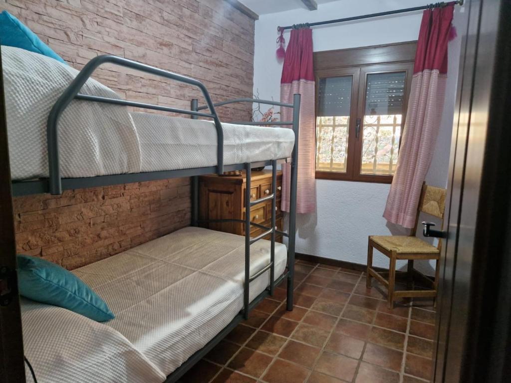 Łóżko lub łóżka w pokoju w obiekcie Aptos El Manantial Burunchel