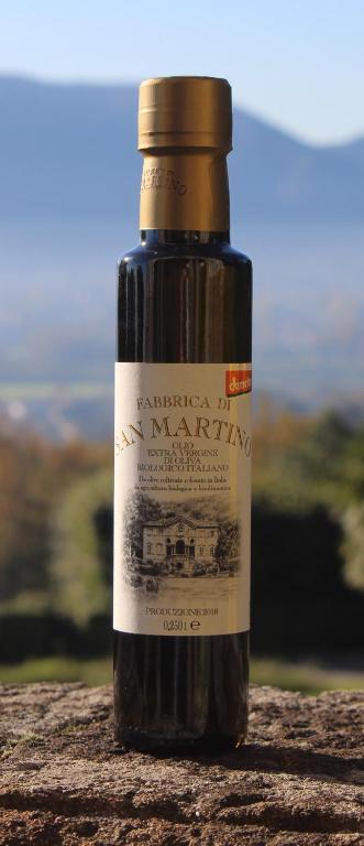 a bottle of jam sitting on top of a table at Azienda Agricola Fabbrica Di San Martino in Lucca
