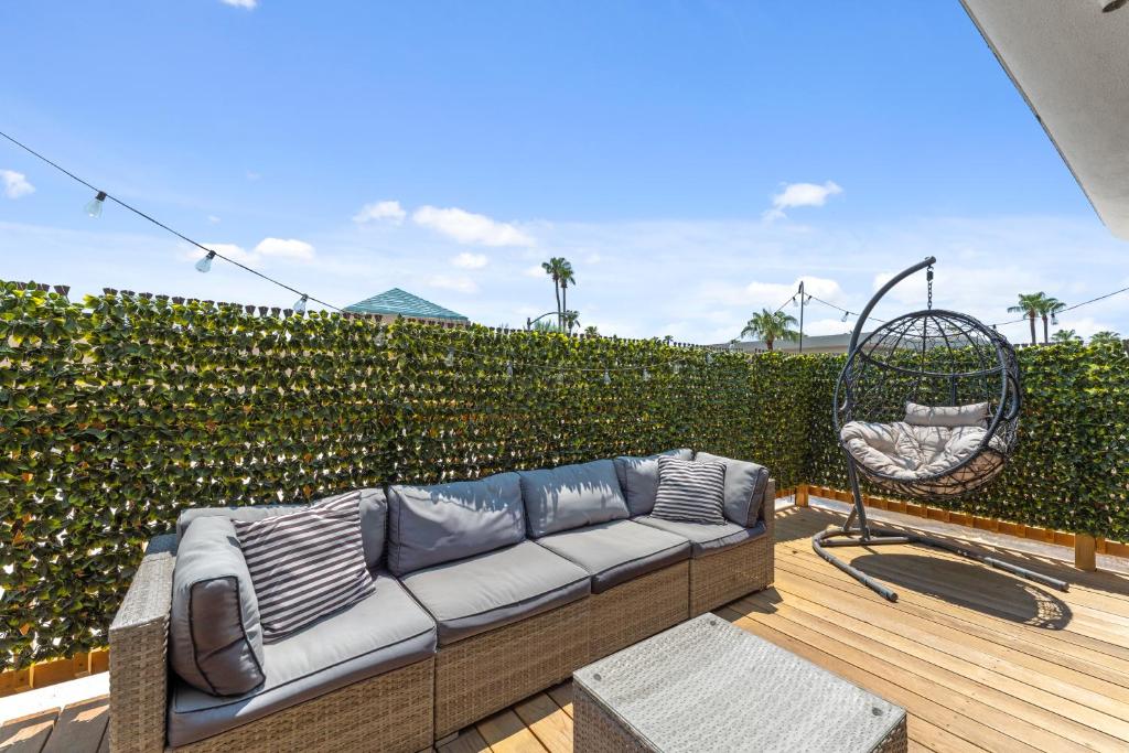 a patio with a couch and a swing at Windfield Condo In The Entertainment District in Scottsdale