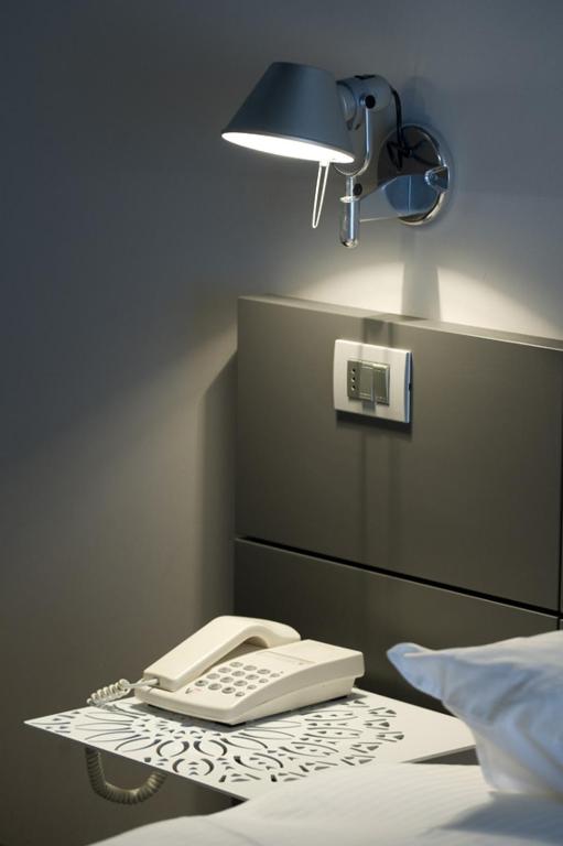 Postel nebo postele na pokoji v ubytování Piccolo Hotel