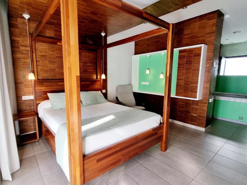 Postel nebo postele na pokoji v ubytování Apartamentos El Arrecife