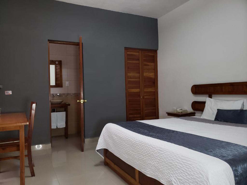 Postel nebo postele na pokoji v ubytování Hotel Pastora