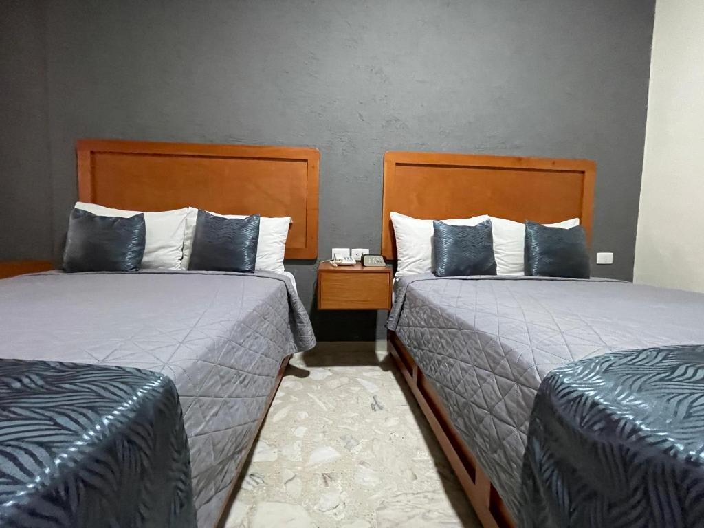 Postel nebo postele na pokoji v ubytování Hotel Pastora