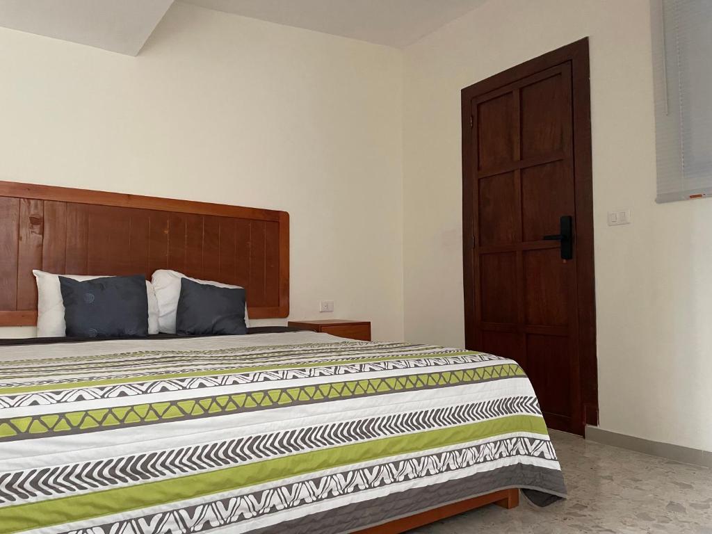 Postel nebo postele na pokoji v ubytování Hotel Pastora
