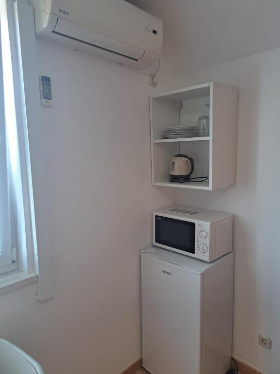 Kuchyň nebo kuchyňský kout v ubytování Apartmani Diki