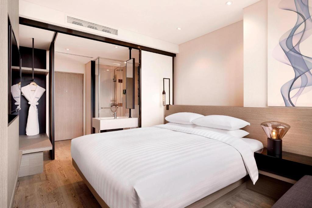 Postel nebo postele na pokoji v ubytování Fairfield by Marriott Seoul
